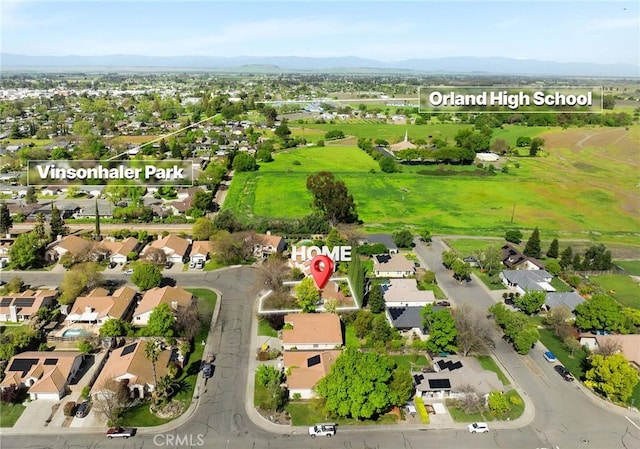 aerial view featuring a mountain view and a residential view
