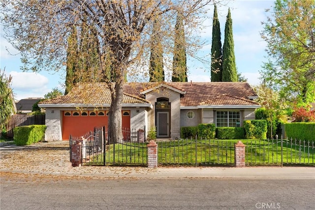 single story home featuring a front lawn, stucco siding, an attached garage, and a fenced front yard