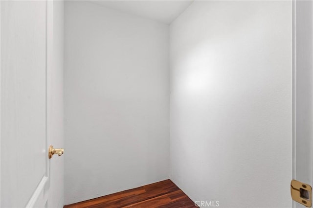 empty room featuring dark wood-style flooring