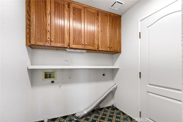 washroom with hookup for an electric dryer, hookup for a gas dryer, visible vents, hookup for a washing machine, and cabinet space