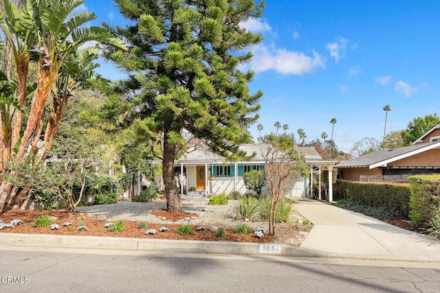 view of front of house with concrete driveway and a garage