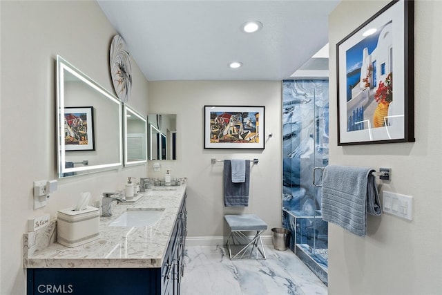 bathroom with a sink, double vanity, marble finish floor, baseboards, and a stall shower