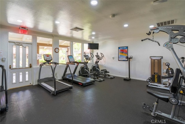 workout area featuring recessed lighting, baseboards, and visible vents