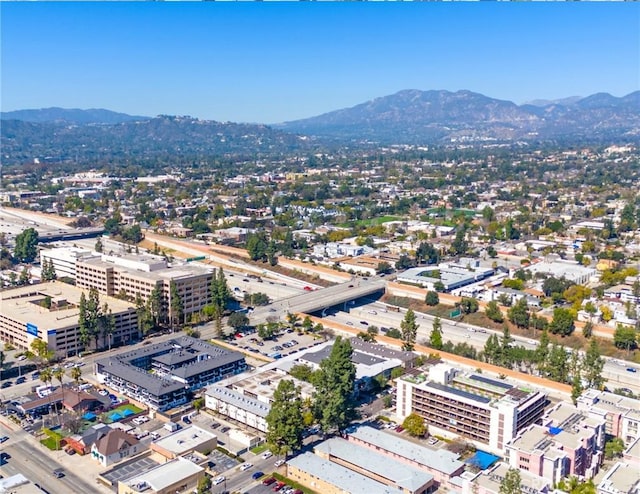 birds eye view of property featuring a mountain view and a view of city