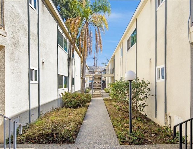 view of community with a residential view and stairs