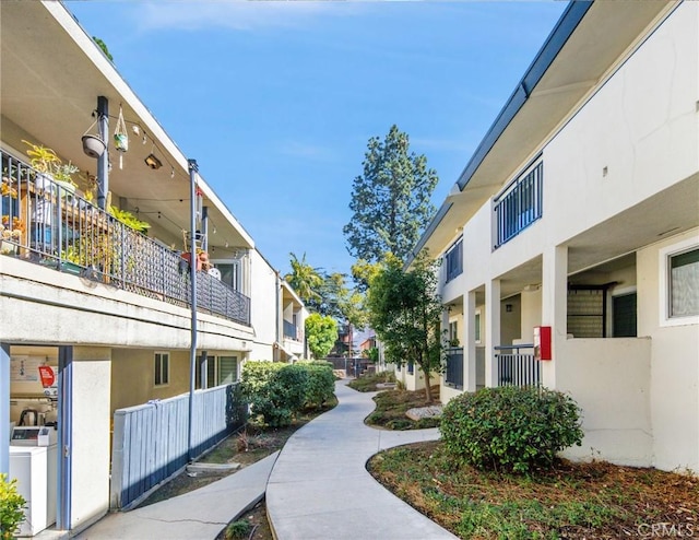 view of home's community with a residential view and washer / clothes dryer