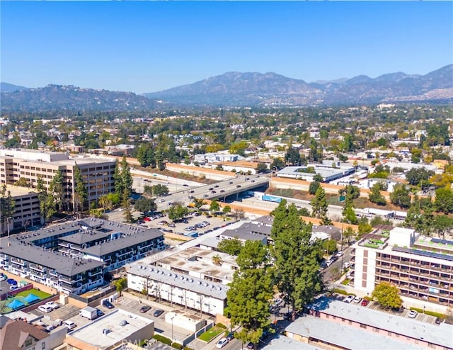 birds eye view of property with a mountain view