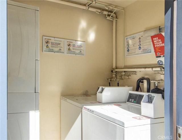 community laundry room with independent washer and dryer