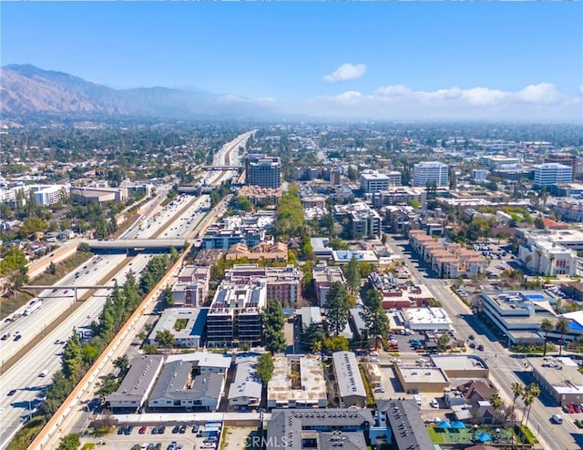 drone / aerial view featuring a view of city and a mountain view