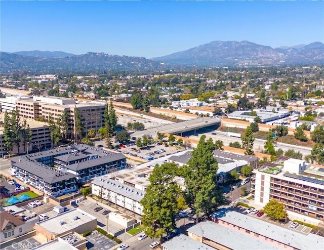 birds eye view of property featuring a view of city and a mountain view