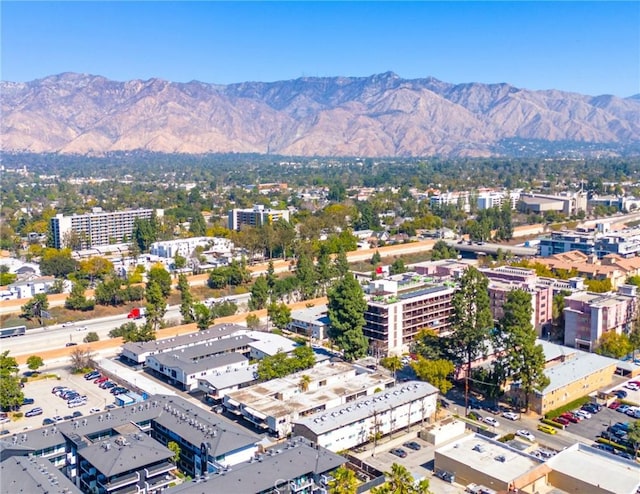 aerial view with a mountain view and a view of city