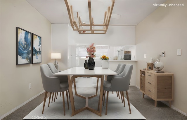 dining area with baseboards and carpet floors