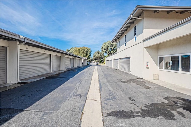 view of street featuring community garages