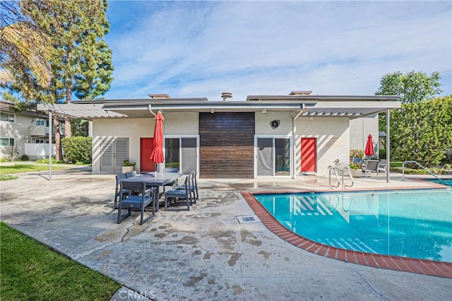 outdoor pool with a patio area