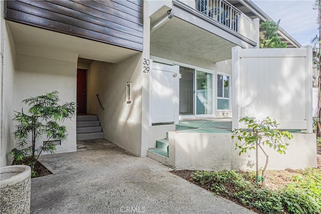 property entrance with a balcony