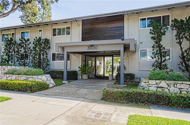 view of property with driveway