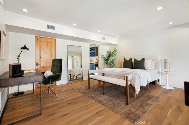 bedroom featuring visible vents, recessed lighting, and light wood-type flooring