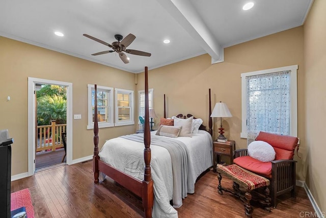 bedroom featuring baseboards, wood finished floors, access to outside, and multiple windows
