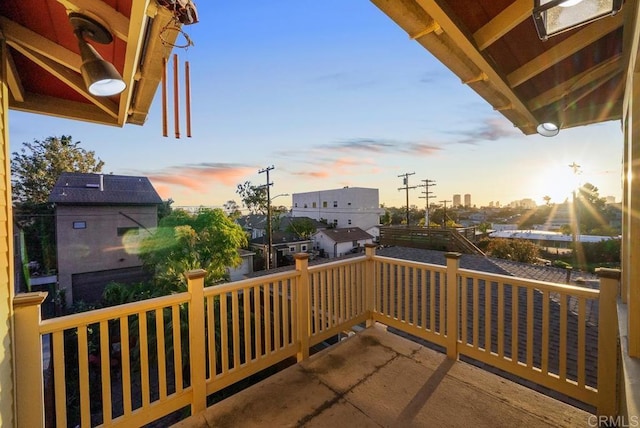 view of balcony at dusk