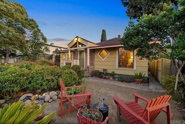 bungalow-style house featuring fence