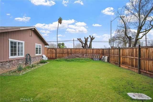 view of yard featuring a fenced backyard