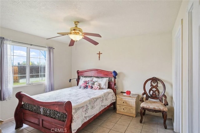 bedroom featuring tile patterned floors and ceiling fan