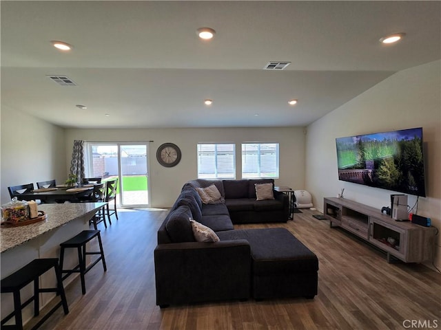 living room featuring visible vents, recessed lighting, and wood finished floors