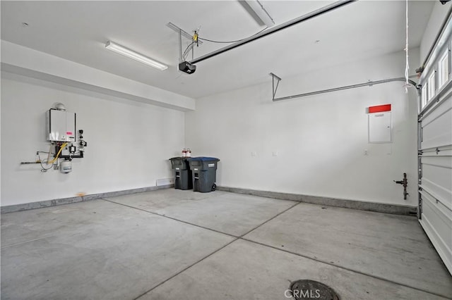 garage featuring a garage door opener and baseboards