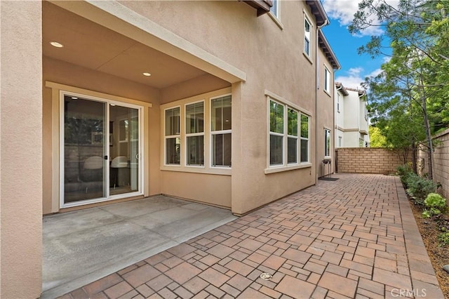 view of patio featuring fence
