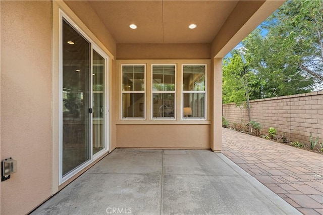 view of patio / terrace featuring fence