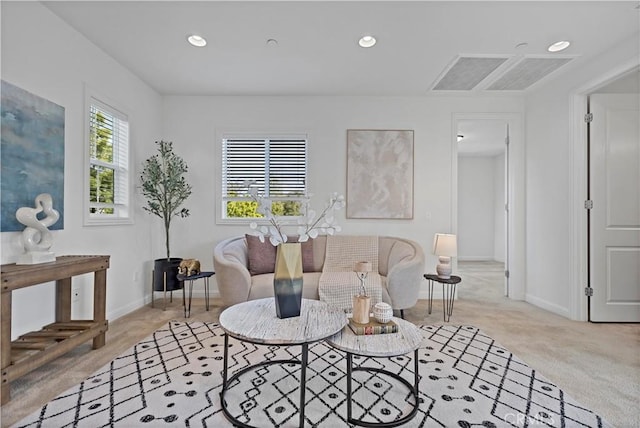 carpeted living room featuring baseboards and recessed lighting