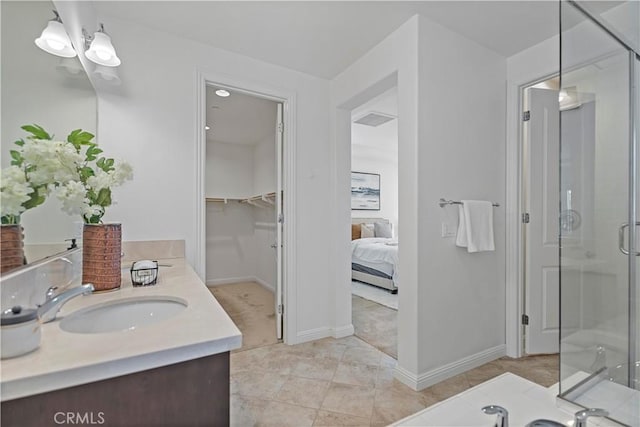 full bath with tile patterned flooring, vanity, baseboards, a shower stall, and visible vents