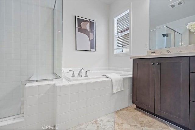 full bathroom with vanity, visible vents, a garden tub, and a shower stall