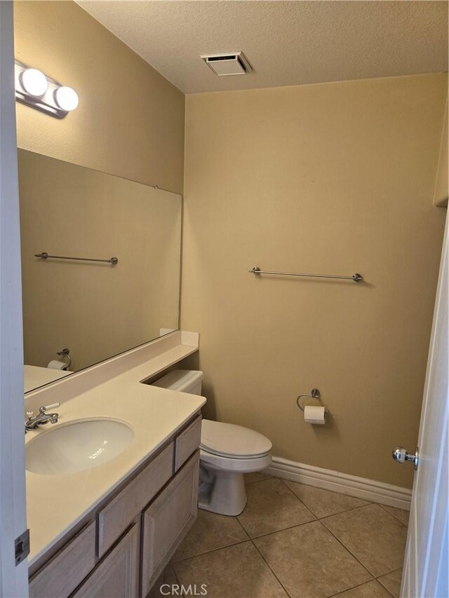 19392 Highridge Way, Trabuco Canyon, CA 92679 - bathroom featuring tile patterned floors, a textured ceiling, vanity, toilet, and visible vents