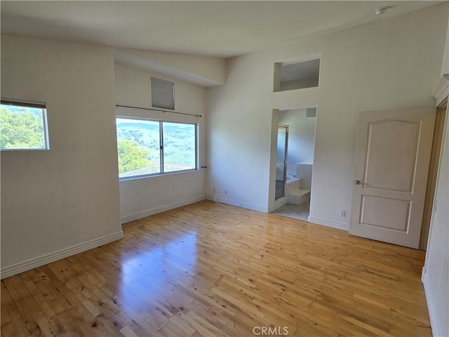19392 Highridge Way, Trabuco Canyon, CA 92679 - unfurnished room with plenty of natural light, visible vents, light wood finished floors, and baseboards