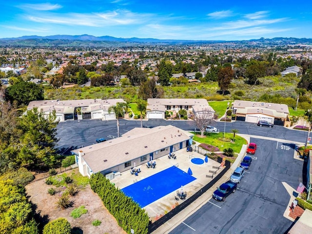 birds eye view of property with a mountain view