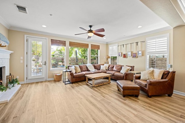 2185 Twain Ave, Carlsbad, CA 92008 - living area featuring a ceiling fan, a brick fireplace, ornamental molding, light wood-style floors, and recessed lighting
