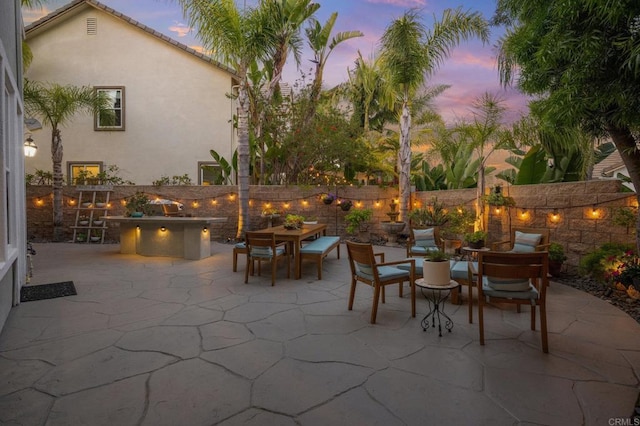 2185 Twain Ave, Carlsbad, CA 92008 - patio terrace at dusk with a patio, a fenced backyard, and outdoor dining space