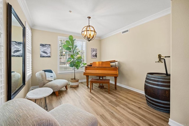 2185 Twain Ave, Carlsbad, CA 92008 - sitting room featuring light wood-style floors, ornamental molding, baseboards, and a chandelier
