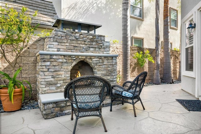 2185 Twain Ave, Carlsbad, CA 92008 - view of patio featuring an outdoor stone fireplace