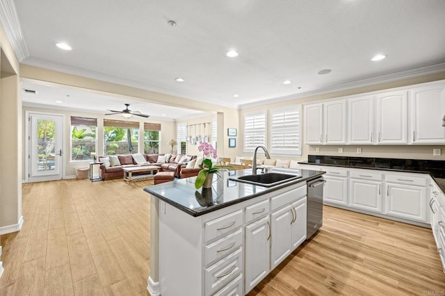2185 Twain Ave, Carlsbad, CA 92008 - kitchen with a sink, crown molding, stainless steel dishwasher, an island with sink, and light wood-type flooring