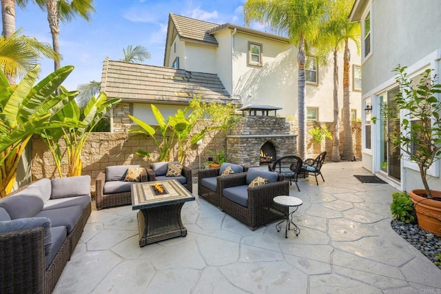 2185 Twain Ave, Carlsbad, CA 92008 - view of patio / terrace with an outdoor living space with a fireplace