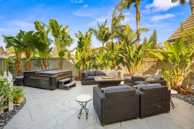 2185 Twain Ave, Carlsbad, CA 92008 - fenced backyard featuring a hot tub, an outdoor living space with a fire pit, and a patio area