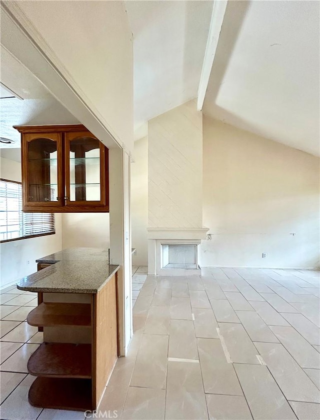 2635 W Monte Carlo Dr Unit 42, Santa Ana, CA 92706 - interior space featuring beam ceiling, light tile patterned flooring, and high vaulted ceiling