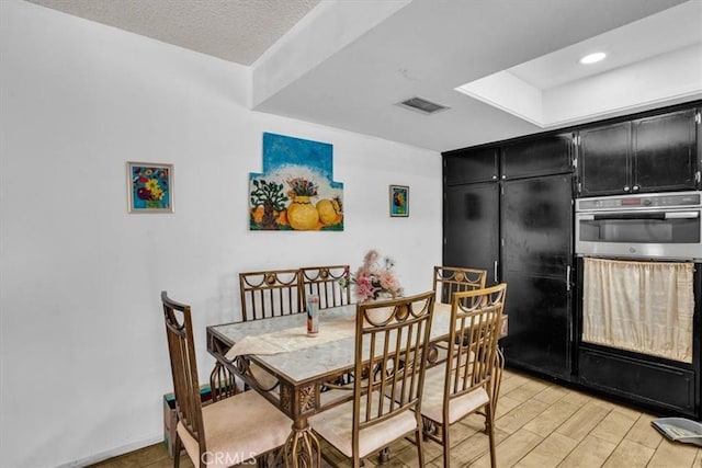 dining space featuring recessed lighting and visible vents