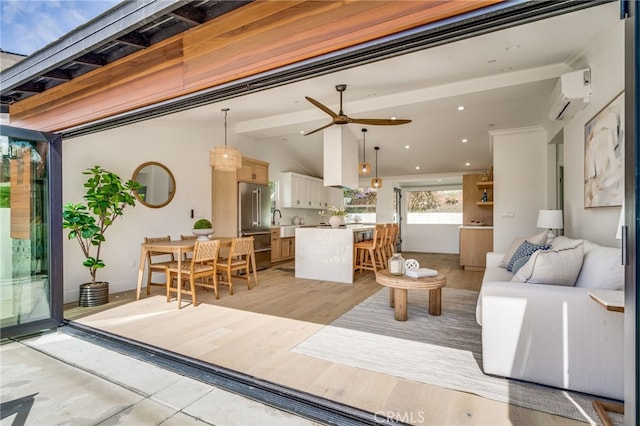 living area featuring recessed lighting, a wall mounted air conditioner, a ceiling fan, and lofted ceiling