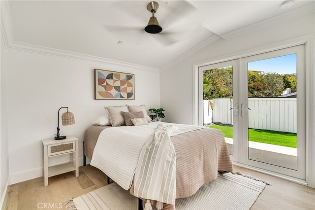 bedroom with access to outside, ornamental molding, light wood finished floors, and lofted ceiling