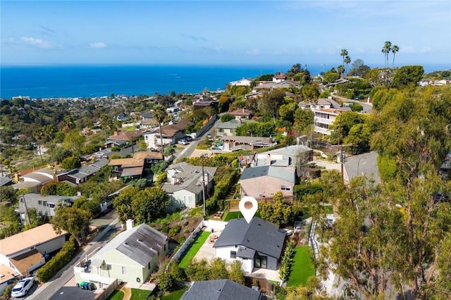 drone / aerial view featuring a water view and a residential view
