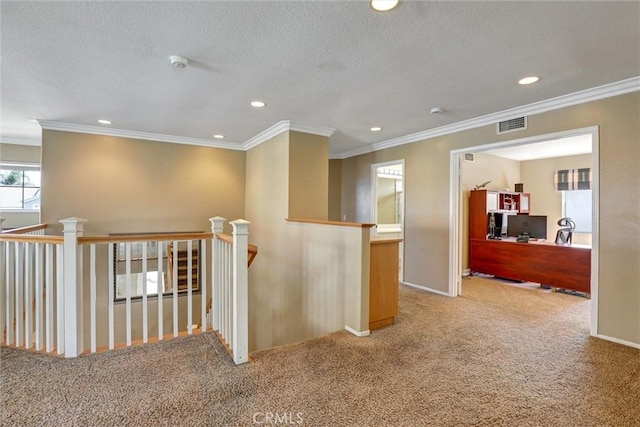 hallway with carpet floors, baseboards, an upstairs landing, ornamental molding, and recessed lighting