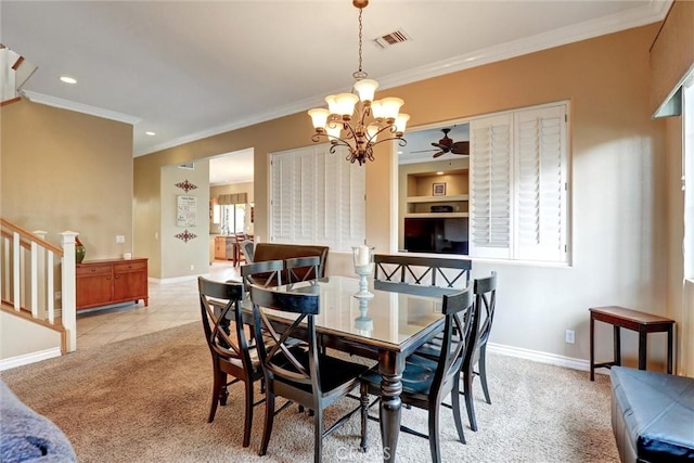 dining room featuring visible vents, baseboards, crown molding, and a notable chandelier